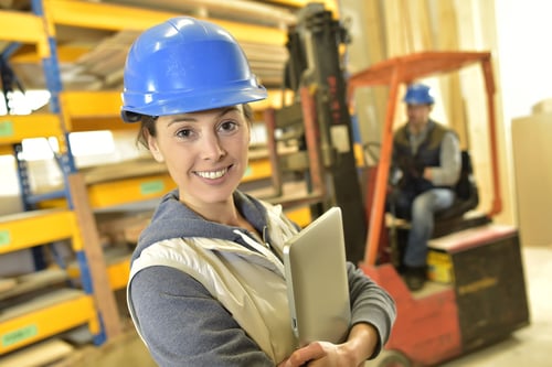 Smiling woman working in warehouse